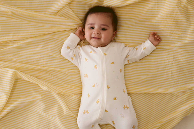 Newborn baby wearing soft newborn clothes