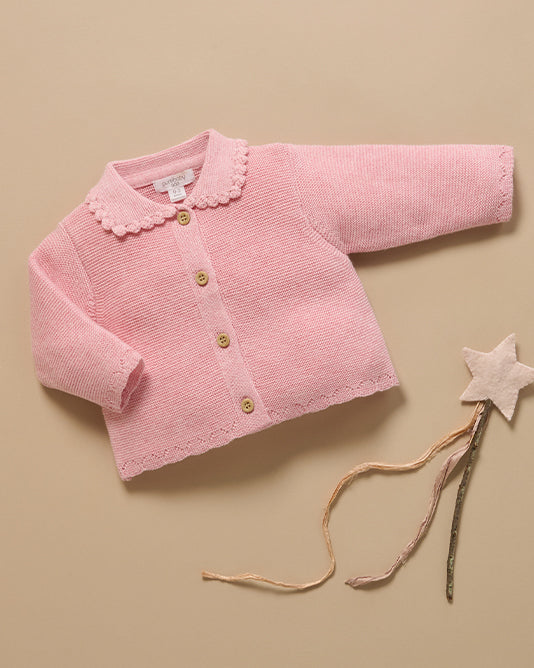 pink baby cardigan and fairy wand