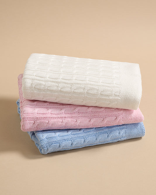 pile of knitted baby blankets